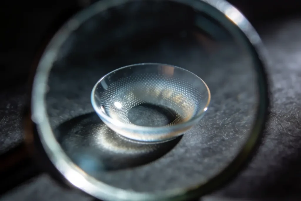examining a soft contact lens closely before reinsertion